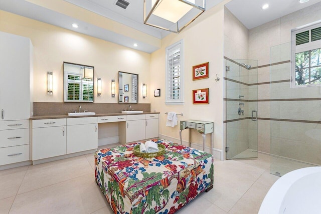 bathroom featuring walk in shower, tile patterned floors, and vanity