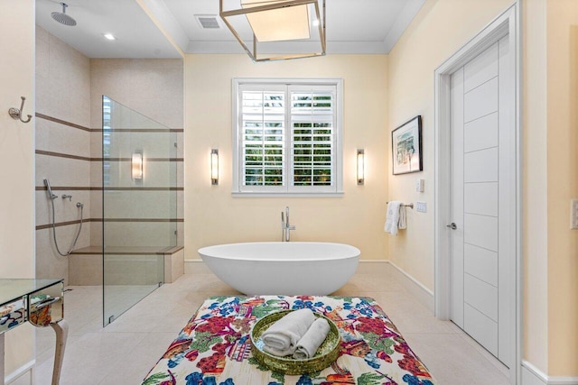 bathroom featuring tile patterned floors and shower with separate bathtub