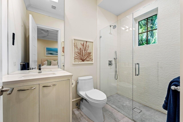 bathroom featuring vanity, toilet, and a shower with door