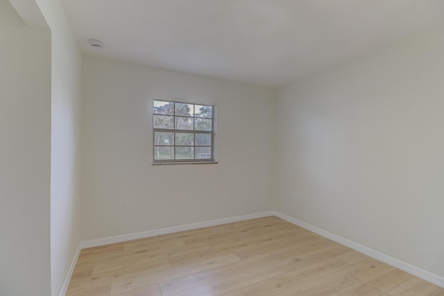 spare room featuring light hardwood / wood-style flooring