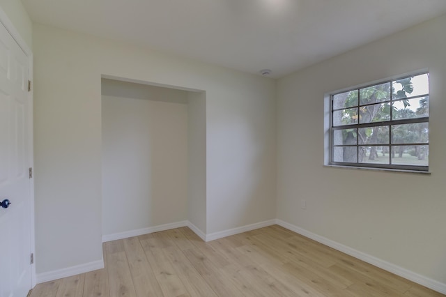 spare room with light wood-type flooring