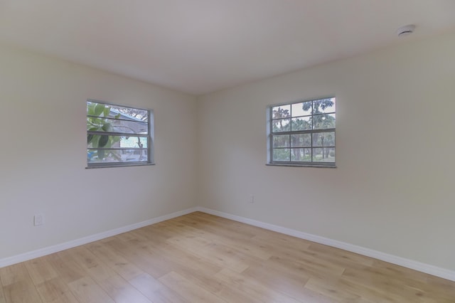 unfurnished room featuring light hardwood / wood-style flooring