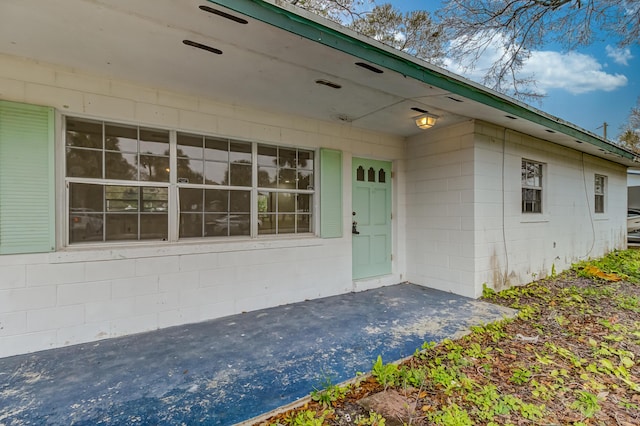 doorway to property featuring a patio area