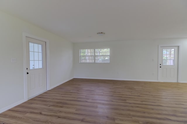 foyer entrance with light hardwood / wood-style floors