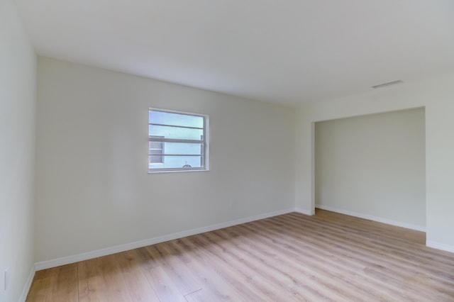 spare room featuring light hardwood / wood-style floors