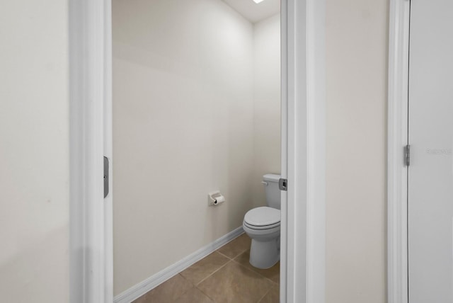 bathroom featuring tile patterned floors and toilet