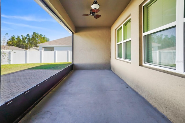 exterior space with ceiling fan