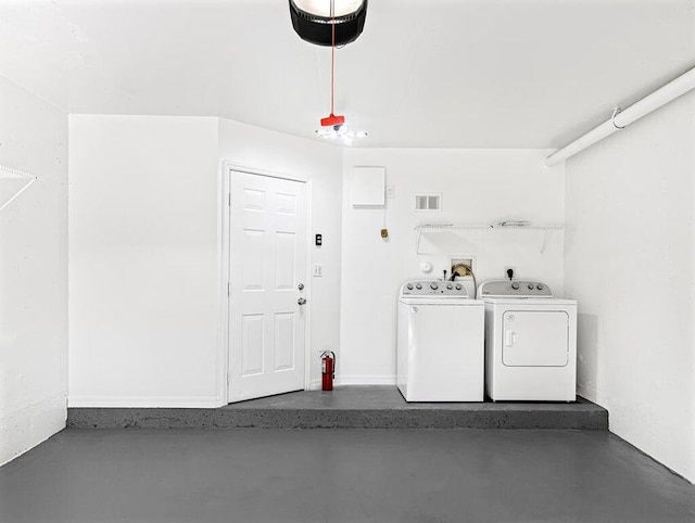 washroom featuring washer and dryer