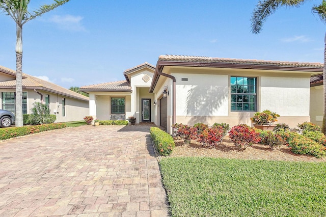 mediterranean / spanish-style house featuring a garage