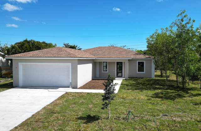 ranch-style home with roof with shingles, stucco siding, a garage, driveway, and a front lawn