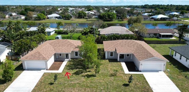 aerial view featuring a residential view and a water view