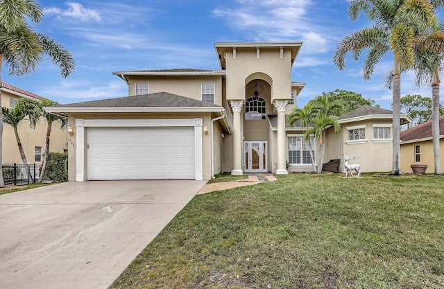 view of front facade featuring french doors, a garage, and a front lawn