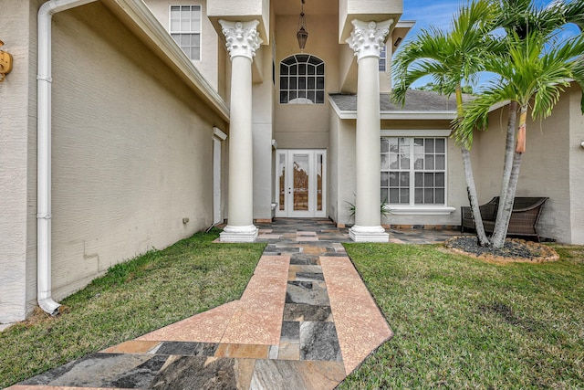 property entrance with a yard