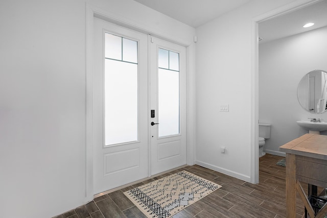 interior space with sink and french doors