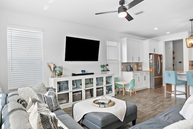 living room featuring ceiling fan