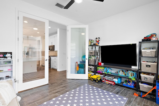 recreation room with french doors and ceiling fan