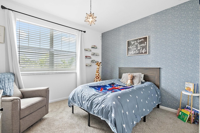 bedroom with light colored carpet