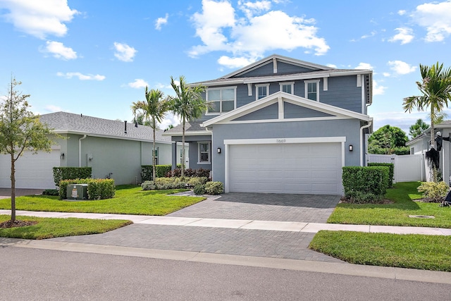 view of front of home featuring a garage and a front yard