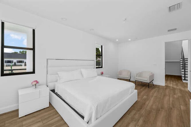 bedroom featuring wood-type flooring