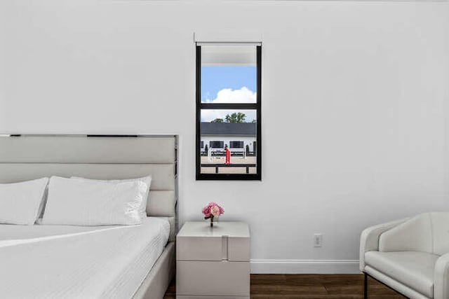 bedroom featuring dark hardwood / wood-style flooring