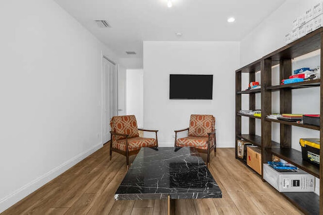 sitting room featuring hardwood / wood-style flooring