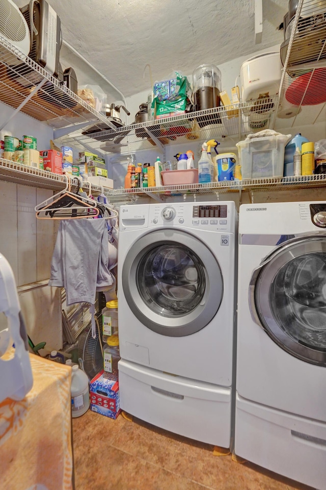 washroom featuring washer and dryer