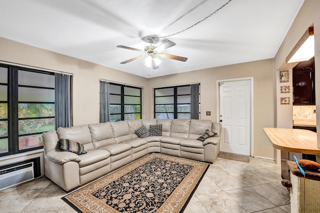 living room featuring ceiling fan and a wall mounted air conditioner