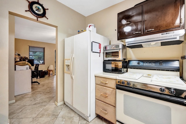 kitchen featuring white appliances, dark brown cabinetry, and light tile patterned floors