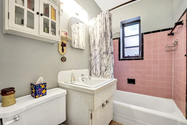 bathroom featuring shower / bathtub combination with curtain and toilet