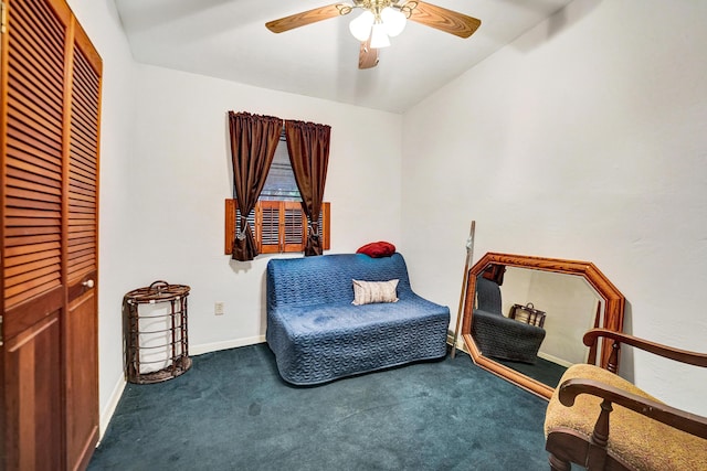 living area featuring lofted ceiling, ceiling fan, and carpet flooring