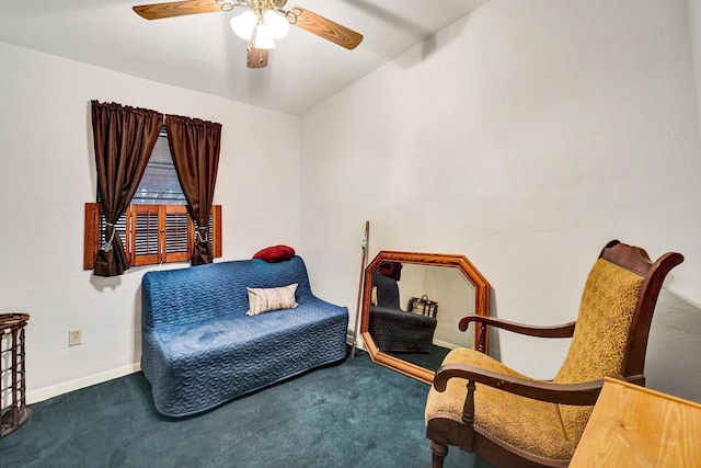 sitting room with lofted ceiling, ceiling fan, and carpet flooring