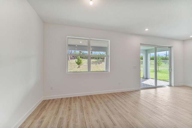 unfurnished room featuring light hardwood / wood-style flooring