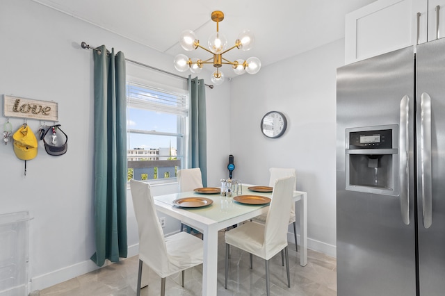 dining space featuring an inviting chandelier