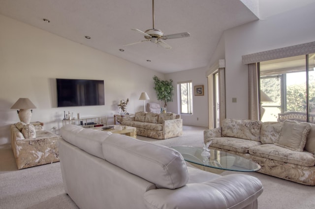 carpeted living room featuring lofted ceiling and ceiling fan