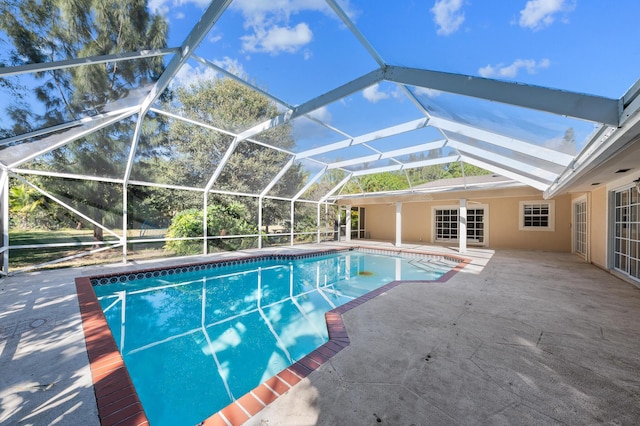 view of pool featuring a lanai and a patio area