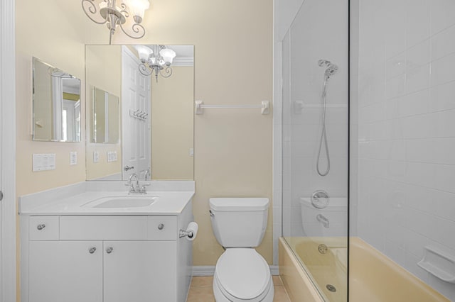 full bathroom with a chandelier, tiled shower / bath combo, vanity, toilet, and tile patterned floors