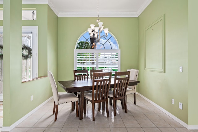 dining space with ornamental molding, light tile patterned floors, and a chandelier