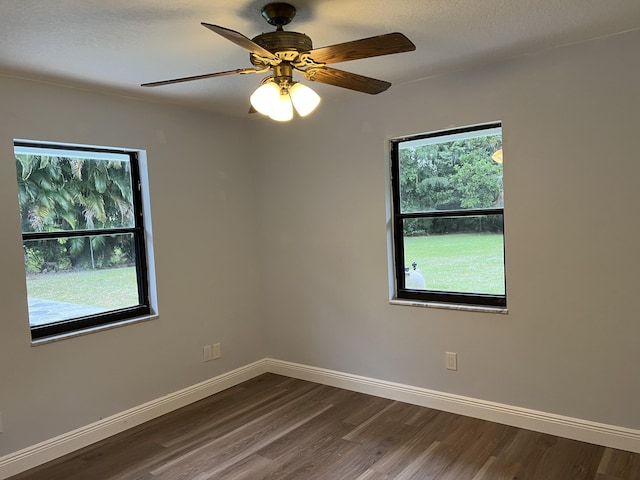 spare room featuring ceiling fan and hardwood / wood-style floors