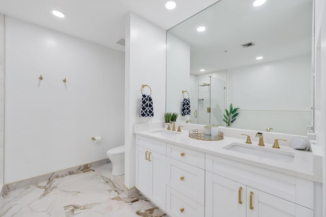 bathroom with vanity, an enclosed shower, and toilet