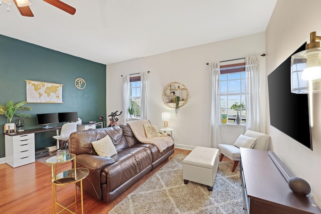 living room with ceiling fan and hardwood / wood-style floors