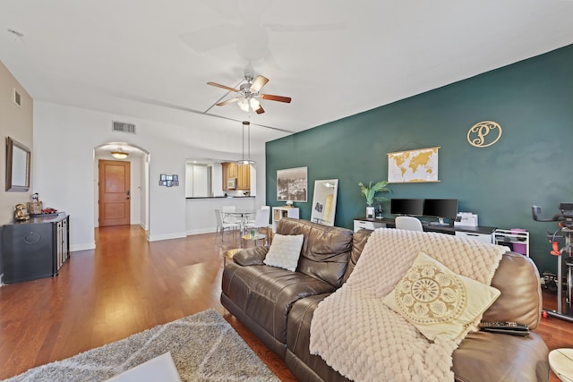 living room with hardwood / wood-style flooring and ceiling fan