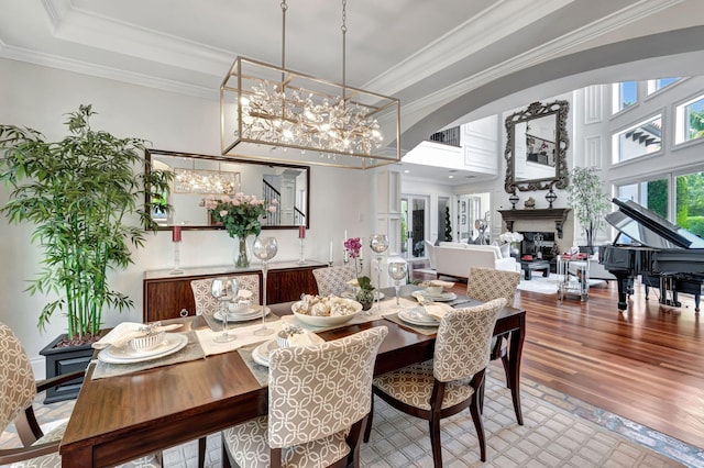 dining room featuring crown molding, an inviting chandelier, and hardwood / wood-style floors