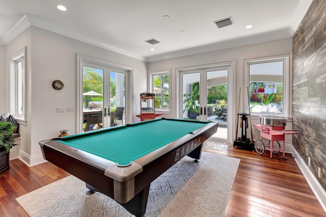 game room featuring crown molding, dark hardwood / wood-style floors, and french doors