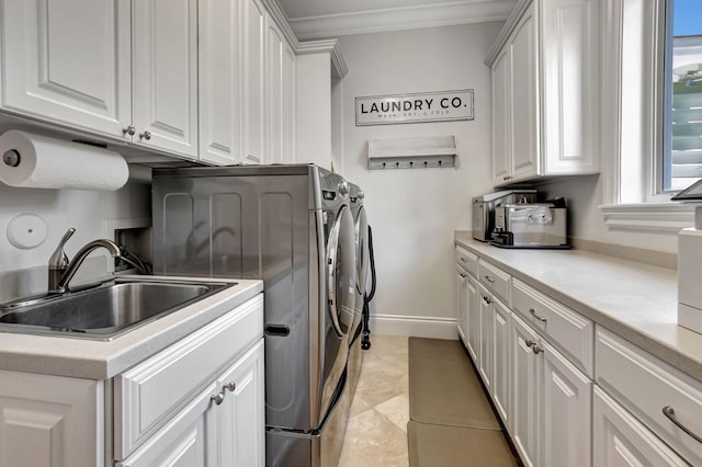 laundry area featuring sink, cabinets, light tile patterned floors, ornamental molding, and independent washer and dryer