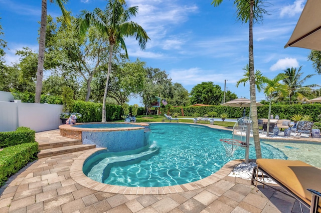 view of swimming pool with an in ground hot tub, pool water feature, and a patio