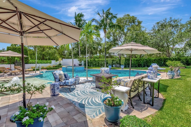 view of pool featuring a yard and a patio