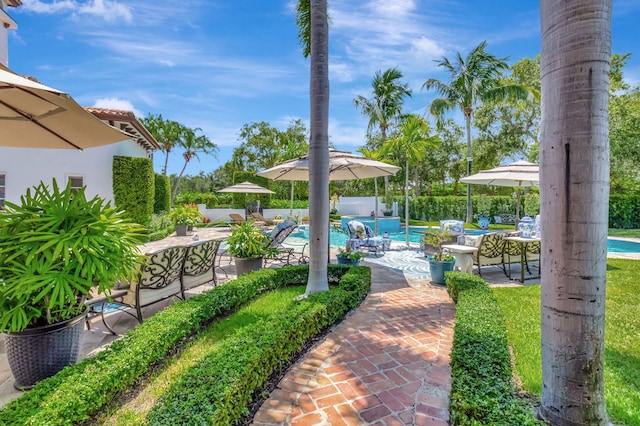 view of patio / terrace with a fenced in pool