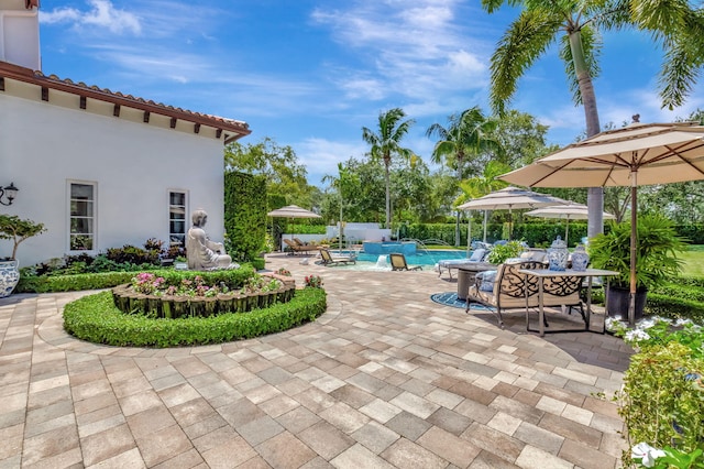 view of patio featuring pool water feature