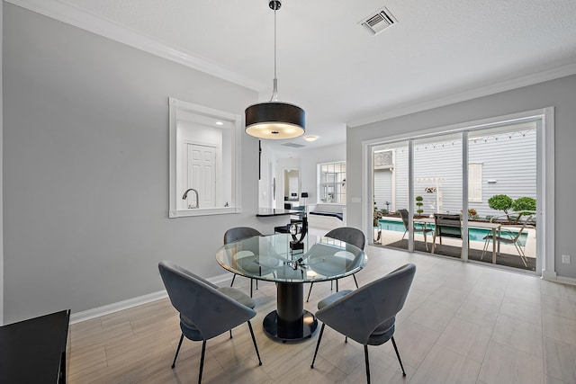 dining room featuring ornamental molding