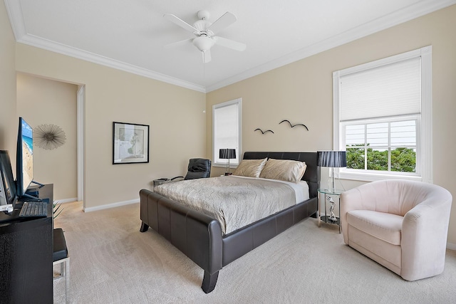 carpeted bedroom with crown molding and ceiling fan